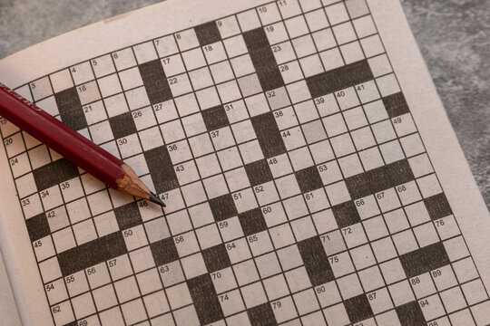 Close up of a black crossword puzzle.