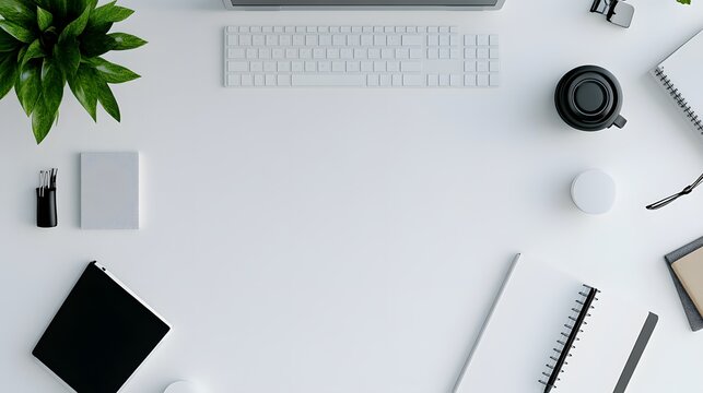 A top-down view of a simple, modern desk setup with clean lines and minimal clutter