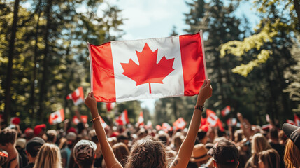 Canadian flag held high at outdoor celebration