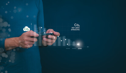 Ideas for reducing carbon emissions or using carbon credits for organizations. Businessman showing carbon credit and green business environmental conservation sustainable environmental development