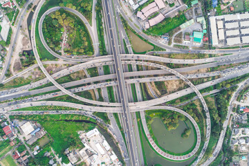 Aerial view transport junction road with green tree park car movement sunset light