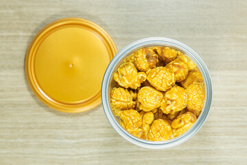 Popcorn with caramel cream in a plastic can
