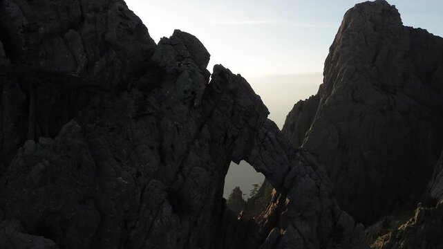 Trou de la Bombe, Massiv dde Bavella, Corse, France at sunrise, view from drone