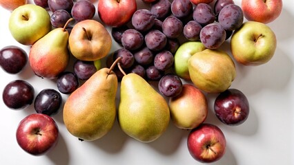 Organic fruits including pears, apples, and plums on white background with ample copy space. Classic fruit assortment concept.