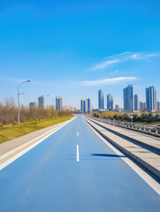 Obraz premium Urban Road to Modern Skyline Under Blue Sky