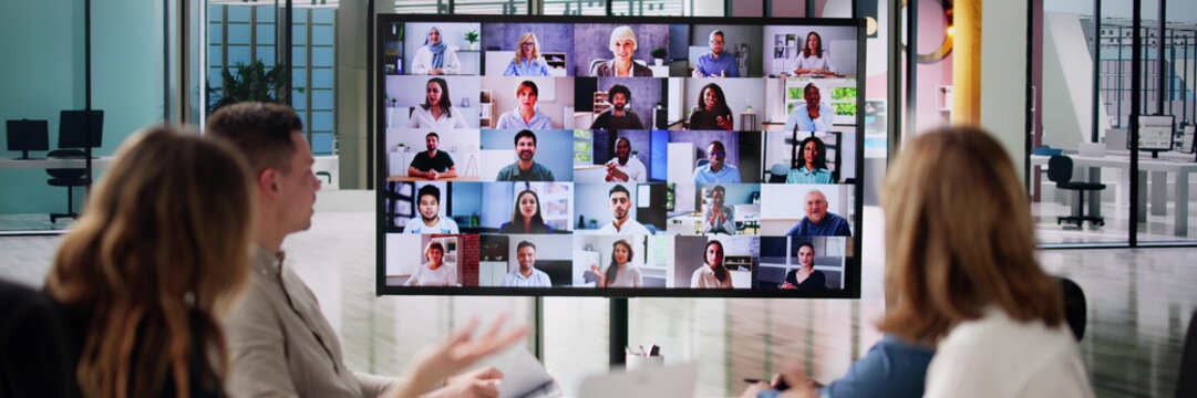 Group Of Businesspeople Having Video Conference - Powered by Adobe