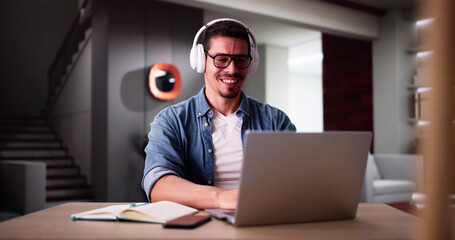 Male Student Studying With Computer Doing Research