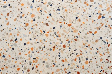 Colorful terrazzo surface with orange blue beige and grey patterns close-up view