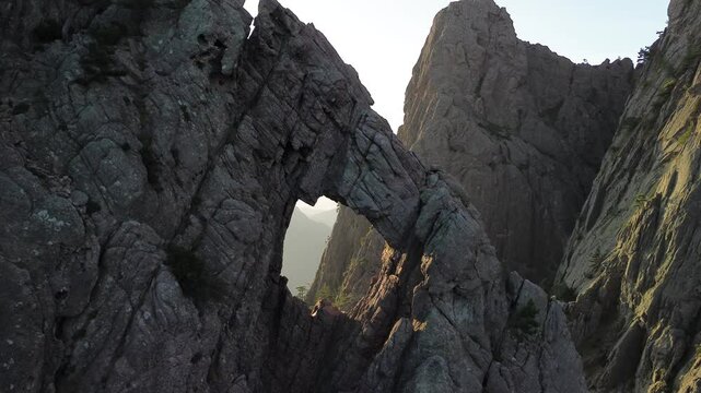 Trou de la Bombe, Massiv dde Bavella, Corse, France at sunrise, view from drone