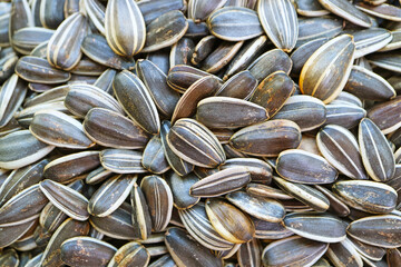 Heap of dried sunflower seeds, snack for improving heart health