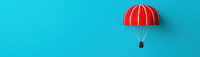 Colorful red parachute against a bright blue background, symbolizing adventure, freedom, and aerial sports.