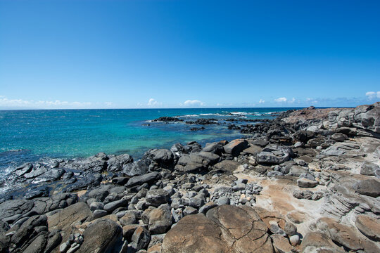 Ho'okipa Beach Park in Maui Hawaii, renowned windsurfing and surf site for wind, big waves and big Turtles drying on sand. Snorkeling paradise for coral reefs.