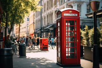 Selbstklebende Fototapeten Iconic Red Telephone Booth on a Busy City Street © evening_tao