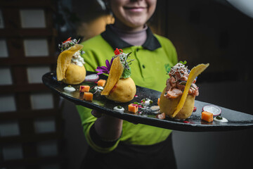 Causa or Causita de papa, typical food from the coast of Peru, on the table of a typical restaurant.