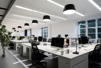 Fototapeta premium Modern Office Interior with Computers at Dusk