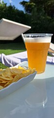 glass of beer with summer background