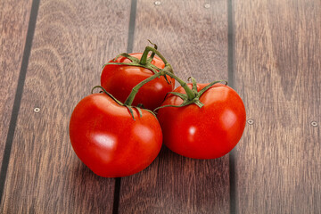 Sweet ripe tomatoes on the branch