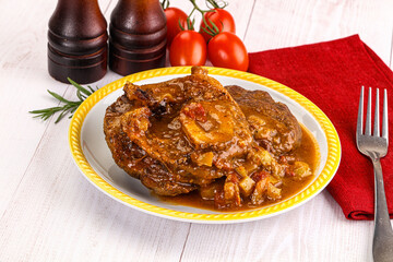 Italian cuisine - ossobuco with sauce