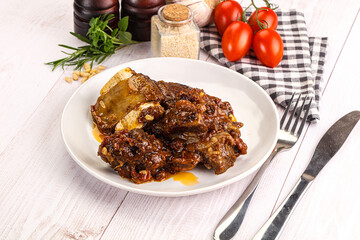 Prepared tasty beef ribs with sauce