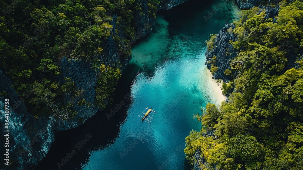 Poster Aerial view of a small wooden boat in a turquoise lagoon surrounded by lush green foliage and cliffs.