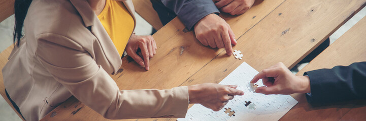 Banner Implement puzzle improve hand holding together solve synergy organize team connection plan trust strategy. Stakeholder business trust teams hands holding jigsaw puzzle synergy with copy space
