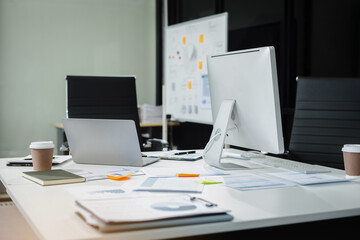 Workspace with desktop computer, office supplies, houseplant and coffee cup at office. desk work concept.