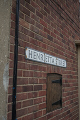 Obraz premium street sign on red brick background. seaside style cottage wall. 