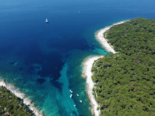 Sailing boat in the blue distance