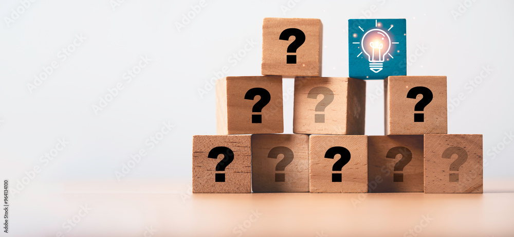 Poster glowing lightbulb on the top of wooden cube of question for problem solving solution and creative th