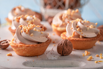 Delicious mini tartlets made of walnuts and cream.