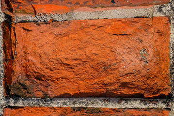 Close up of an old brick in the wall.