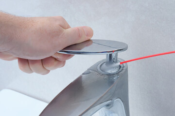 Use spray restorative liquids to lubricate an old ball valve in a bathroom.
