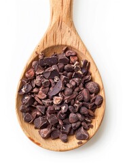 Fototapeta premium A spoonful of chocolate is shown on a white background. The spoon is wooden and the chocolate is in a pile. Scene is warm and inviting, as the chocolate is a popular treat that many people enjoy