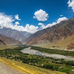 Wide view of Wakhan Corridor of Panj river valley and Hindu Kush mountain range in Afghanistan at Langar, Gorno-Badakhshan, Tajikistan Pamir