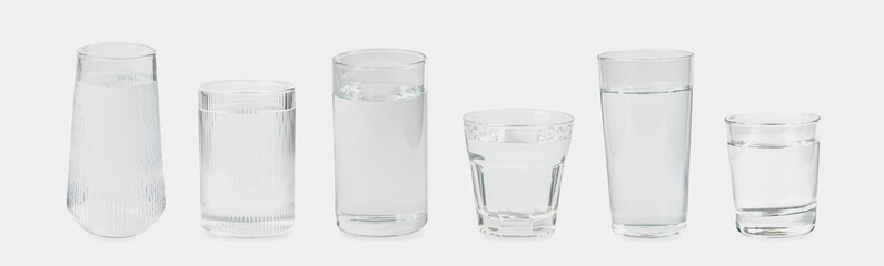 Many glasses of fresh clean drink water isolated on white background.
