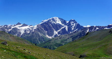 Fototapeta premium mountain landscape with slope with alpine weadows on a foreground