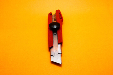sharp cutter knife with red handle
