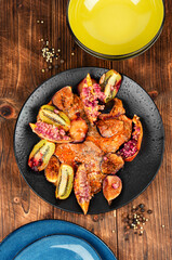 Pork steaks in fruit marinade.