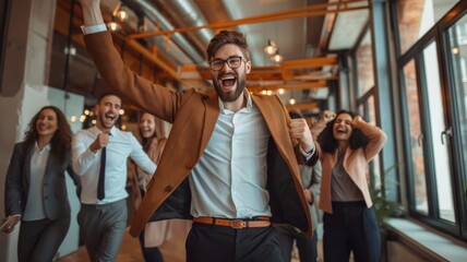 Ecstatic businessman leading team in joyful celebration