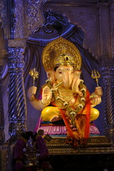Fototapeta premium 07 September 2024, Pune, Maharashtra, India, Beautiful sculpture of Lord Ganesh called as Tambdi Jogeshwari Ganpati near ABC chowk, Pune, during Ganesh Utsav Festival 2024.