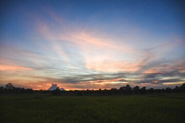 Orange sky with clouds at sunset