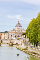 Fototapeta premium Rome, Italy - April 09, 2024: Tiber river in Rome with tourists crowding its surroundings in Rome, Italy