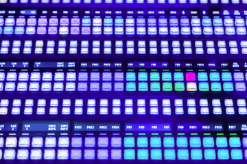 Control broadcasts in recording studio. Modern video mixer panel with many colored, glowing buttons. Modern Live television broadcast video switcher production. Controlled in a broadcast studio.