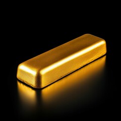 Gold Bar Isolated on Black Reflective Surface