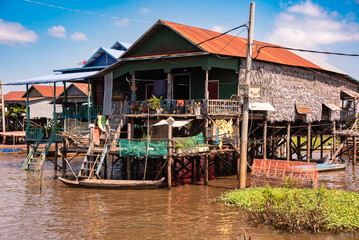 Floating village in Cambodia with traditional wooden houses