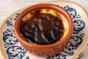 Traditional turkish dessert bakery rice pudding Turkish name Firin Sutlac in ceramic bowl