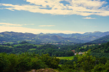 Naklejka premium Amaiur (Maya). Typical landscapes of the Baztán Valley. Amaiur is a Pyrenean town with an incredible natural environment, surrounded by green meadows at the end of summer and gentle hills.