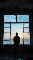 32. A person standing in front of a window with a view