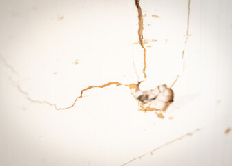 Broken drywall boards flat panel made from gypsum plaster sandwiched between two sheets of thick paper at garage of residential house in Dallas, Texas, surface defects need patch and repair DIY