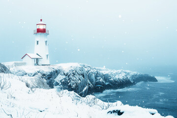 Winter lighthouse standing tall on a rocky coastline